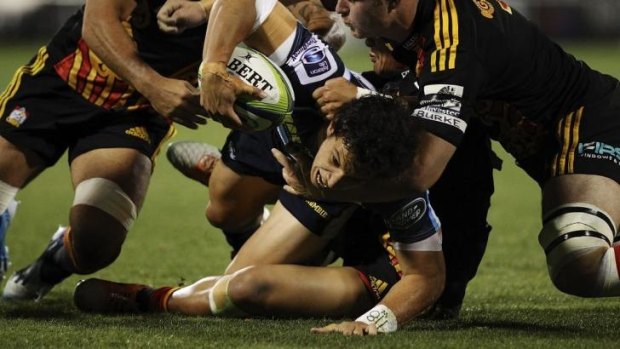 Brumbies playmaker Matt Toomua reaches out to score one of his two tries on Friday night.