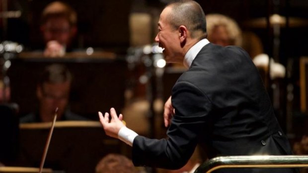 Composer and conductor Tan Dun leads the Melbourne Symphony Orchestra during its <i>East Meets West: Chinese New Year Concert</i>. 