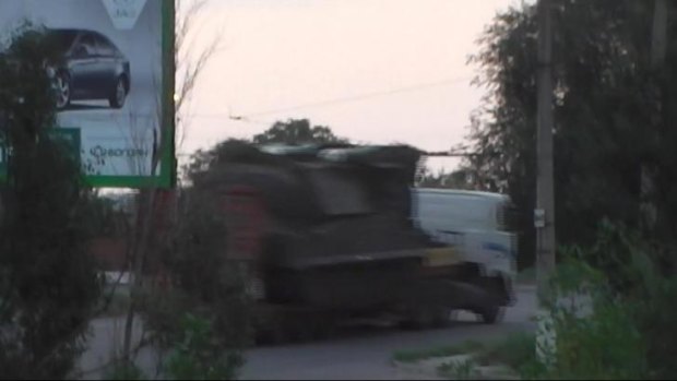 This is a still taken from a video made available by the Ukrainian Interior Ministry, which they said purportedly shows a truck carrying the Buk-M1 missile launcher it said was used to fire on MH17 back to Russia.