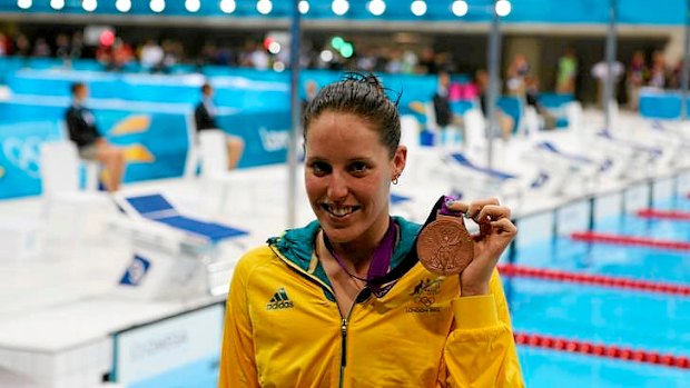 Bronze ... Australia's Alicia Coutts shows off her medal after coming third in the 100m butterfly.