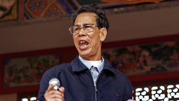 Pressure from above &#8230; Lin Zuluan speaks at this week's election rally in Wukan. The former protest leader is expected to be elected unopposed as village chief.