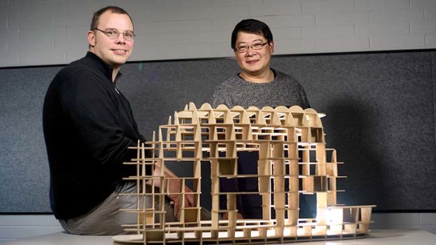 Hands-on roles: David Leggett and Paul Loh with a digital model.