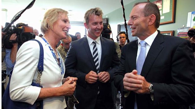 Lieutenant Colonel Cate McGregor, pictured with former cricketer Brett Lee and Prime Minister Tony Abbott, during the launch of the Prime Minister's XI late last year.