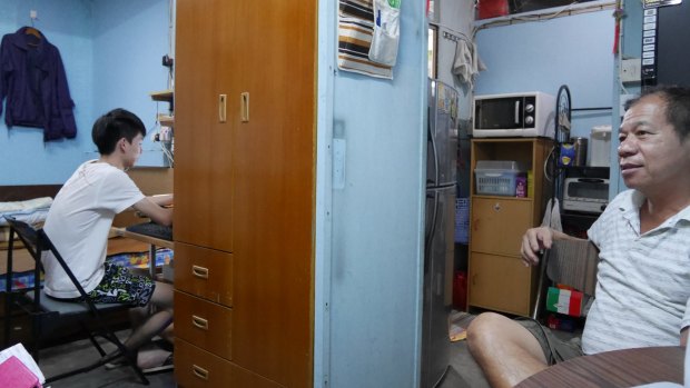 Generation gap: Dasher Mak and his father in their rooftop flat in Sham Shui Po.