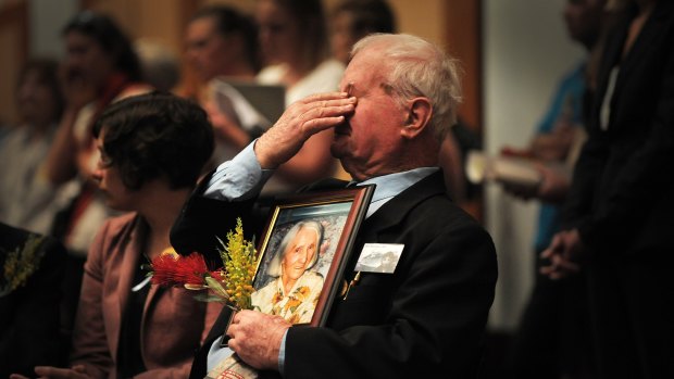 Grief ... John Hennessy of Ingleburn  yesterday with a picture of his late mother, Mary.