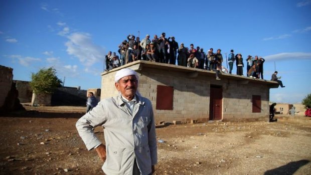 Border village of Alizar residents wait in fear from mortar fired from Islamic State fighters as they tighten their siege of the strategic town of Kobani on Syria's border with Turkey.