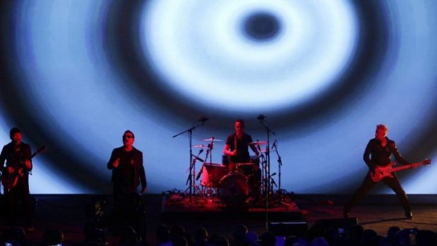 U2 perform at the Apple launch on September 9, 2014.