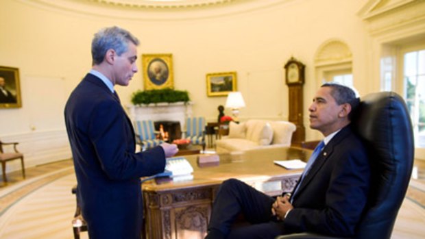 Mr Obama with chief of staff Rahm Emanuel in the Oval Office today, the first working day of the new administration.