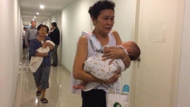Two of the babies found with surrogate mothers in a Bangkok condominium. 