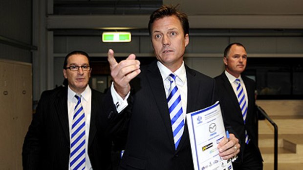 From left: North Melbourne chief executive Eugene Arocca, chairman James Brayshaw and director Mark Brayshaw at the club’s annual meeting.