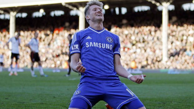 Chelsea's German striker Andre Schurrle celebrates scoring his third goal to complete his hat-trick during the English Premier League match against Fulham at Craven Cottage.