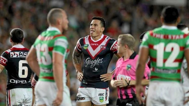 Tongue twister: Sonny Bill Williams, centre, puts on a show after the South Sydney-Roosters clash at Allianz Stadium.