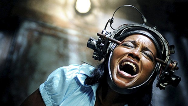 Thats got to hurt ... Tanedra Howard torments herself in at least three ways in a scene from <i>Saw VI.</i>
