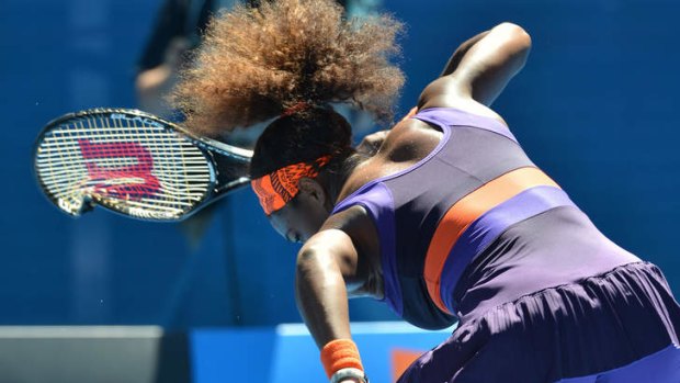 Agitated ... Serena Williams smashes her racquet.