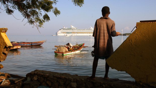 Ruth Fremson/The New York Times: The Royal Caribbean cruise ship Voyager of the Seas seen here docked recently at the Labadie Beach Resort in northern Haiti.