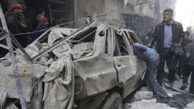 Residents look for survivors after a bomb attack in Aleppo.