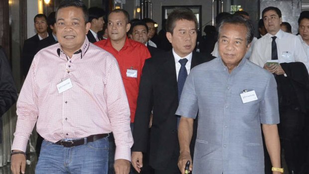 Leaders of the pro-government Red Shirts, from left, Jatuporn Prompan, Nattawut Saikua, unidentified, and Veerakan Musikapong arrive for the ill-fated meeting at the Army Club.