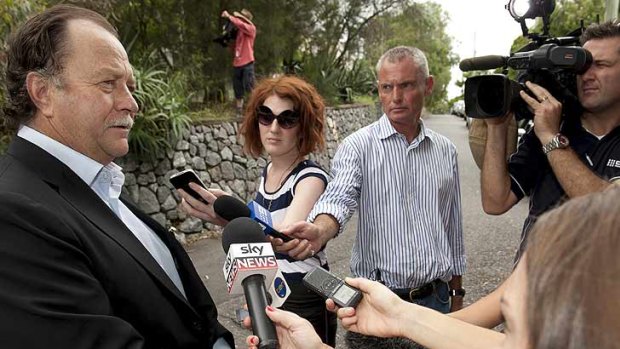 Bruce Hawker speaks to the media outside the Rudd Family home in Brisbane on February 26, 2012.