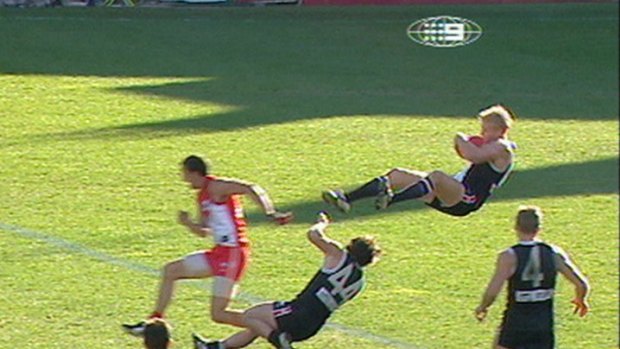 Nick Riewoldt [St Kilda] running back with the flight of the ball, takes one of footy's great marks in 2004 at the SCG