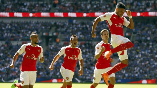 Time to shine: Alex Oxlade-Chamberlain celebrates Arsenal's winning goal in the Community Shield.