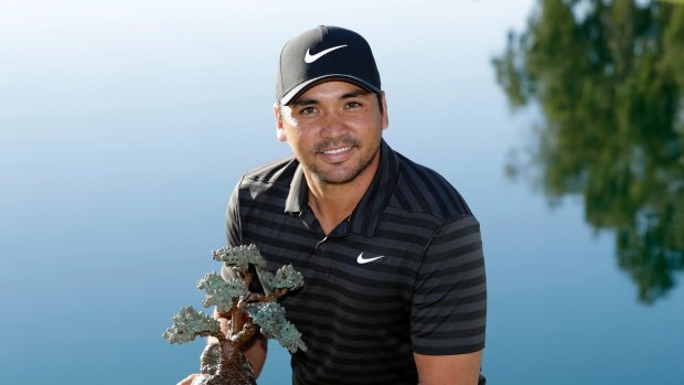 Lofty goal: Jason Day holds the trophy after winning the Farmers Insurance Open.
