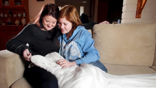 Karlina Macartney and Sami Burgess admire Sami’s dress ahead of the school debutante ball.