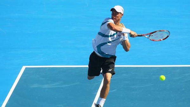 In the swing of things ... Lleyton Hewitt hits a forehand during yesterday's victory over France's Gael Monfils.