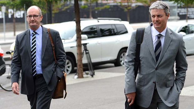 Port Adelaide president David Koch and Hawthorn's Andrew Newbold arrive at AFL House to meet with the commission.