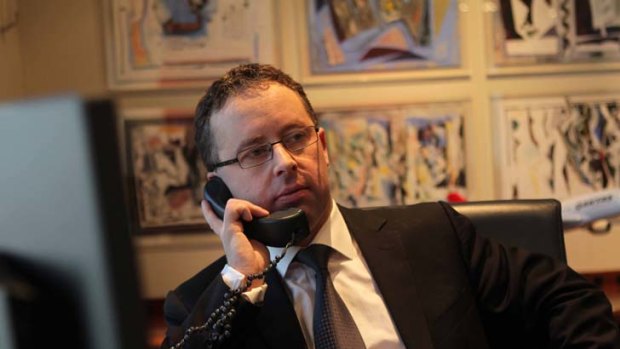Chief executive Alan Joyce is remaining calm as the pressure mounts on him at the Qantas head office in Sydney yesterday.