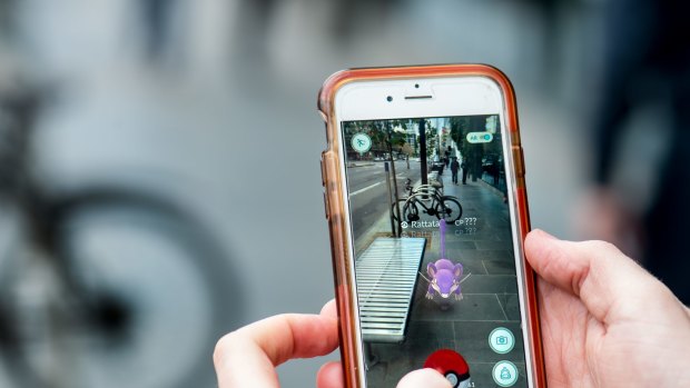 A player of Pokemon Go,  augmented-reality app.