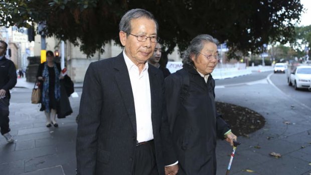 Yang Fei Lin, left, and Feng Qing Zhu, grandparents of the Lin family, at the murder trial of Robert Xie.