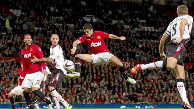 Manchester United's Javier Hernandez scores the winner against Liverpool.