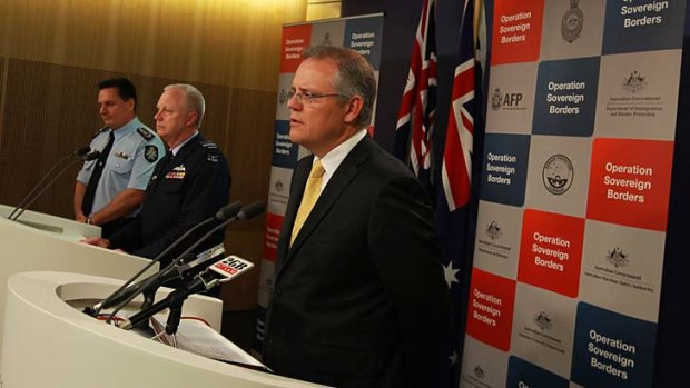 Immigration minister Scott Morrison addresses the media with AFP commissioner Tony Negus and Operation Sovereign Borders acting commander, Air Marshal Mark Binskin.