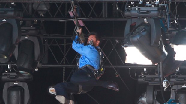 Hugh Jackman is tangled in rigging after his flying fox entrance fails.