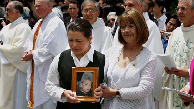 Traumatised: Kim Nguyen at the funeral of her son Van after he was executed in 2005.