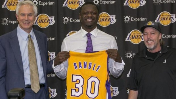 New sensation: The Los Angeles Lakers general manager Mitch Kupchak Lakers part-owner and executive vice president of basketball operations, Jim Buss, introduce forward Julius Randle in El Segundo. The former Kentucky forward was selected seventh overall by the Lakers during the 2014 NBA draft.