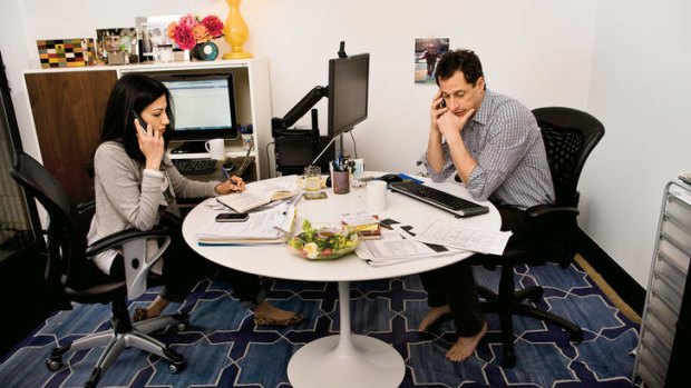 “I live with a lot of guilt about what I put her through” … Abedin and Weiner at work in their New York apartment.