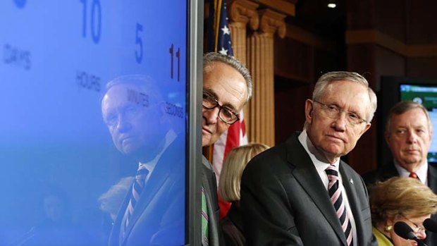 Ticking by: Harry Reid watches a countdown to government shutdown.