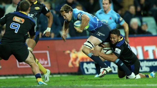 Try time: Stephen Hoiles scores against the Hurricanes in May.