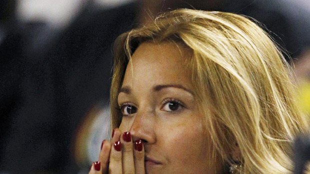 Djokovic's girlfriend Jelena Ristic watches on with concern from the player's box.