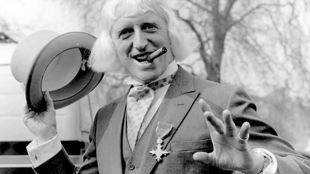 Jimmy Savile sporting his OBE after his investiture at Buckingham Palace in 1972.