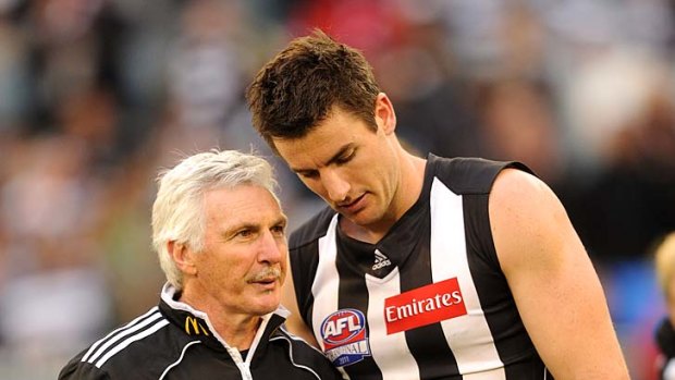 Mick Malthouse and Darren Jolly after the 2011 grand final loss.