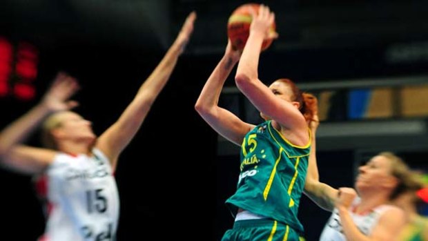 Australian captain Lauren Jackson lifted the defending champions to victory over Canada.