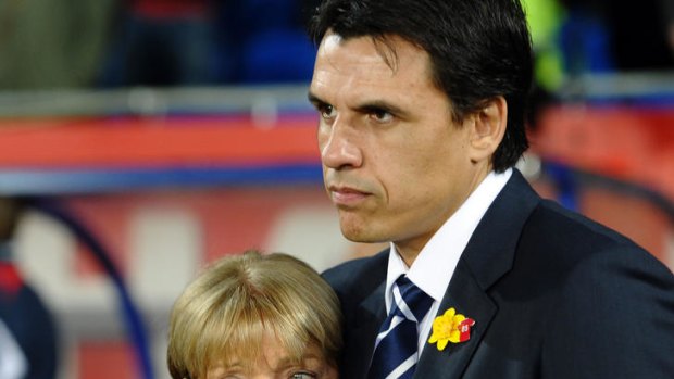 Grief ... the mother of Gary Speed is embraced by new Wales manager Chris Coleman.
