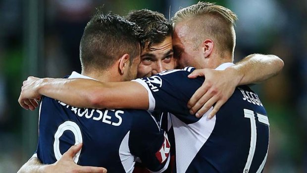 James Troisi (centre) of the Victory celebrates a penalty goal with James Jeggo (right) and Kostas Barbarouses.