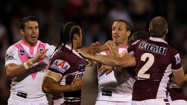 Tempers flare as Steve Matai of the Sea Eagles scuffles with Mark Gasnier.