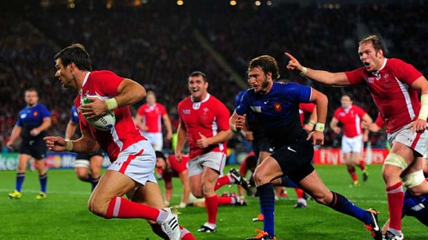 Halfback Mike Phillips of Wales sneaks through to score the only try of the game.