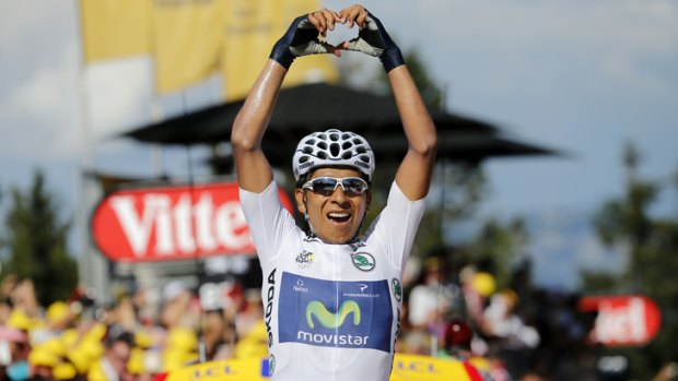 Colombia's Nairo Quintana celebrates as he crosses the finish line at the end of the 125 km twentieth stage of the Tour de France.