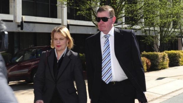 Peter Slipper arrives at the Magistrates Court with his lawyer, Kylie Weston-Scheuber.