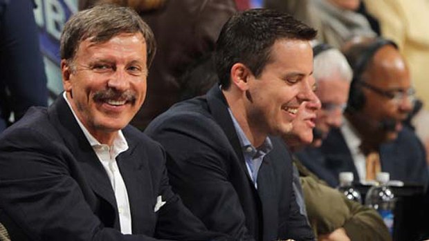 Stan Kroenke (L) and his son Josh watch the family-owned Denver Nuggets.